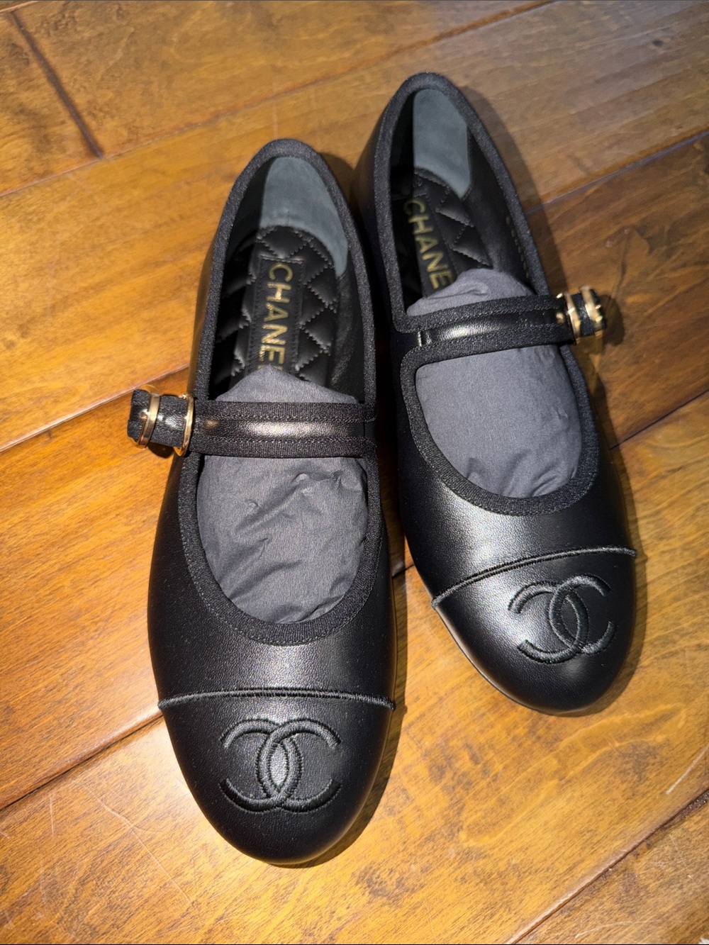 CHANEL Black Leather Mary Jane Flats with CC Cap Toe and Gold Buckles
